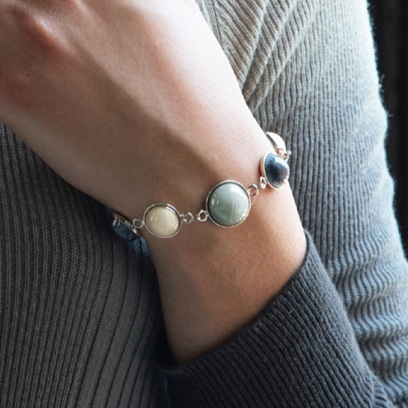 Model wearing MURRINAMURANO Venezia bracelet from the Audrey Collection, handcrafted in Original Murano glass, 18KT Gold Finish or Rhodium finish, over Brass. Made in Italy – murrinamurano.us