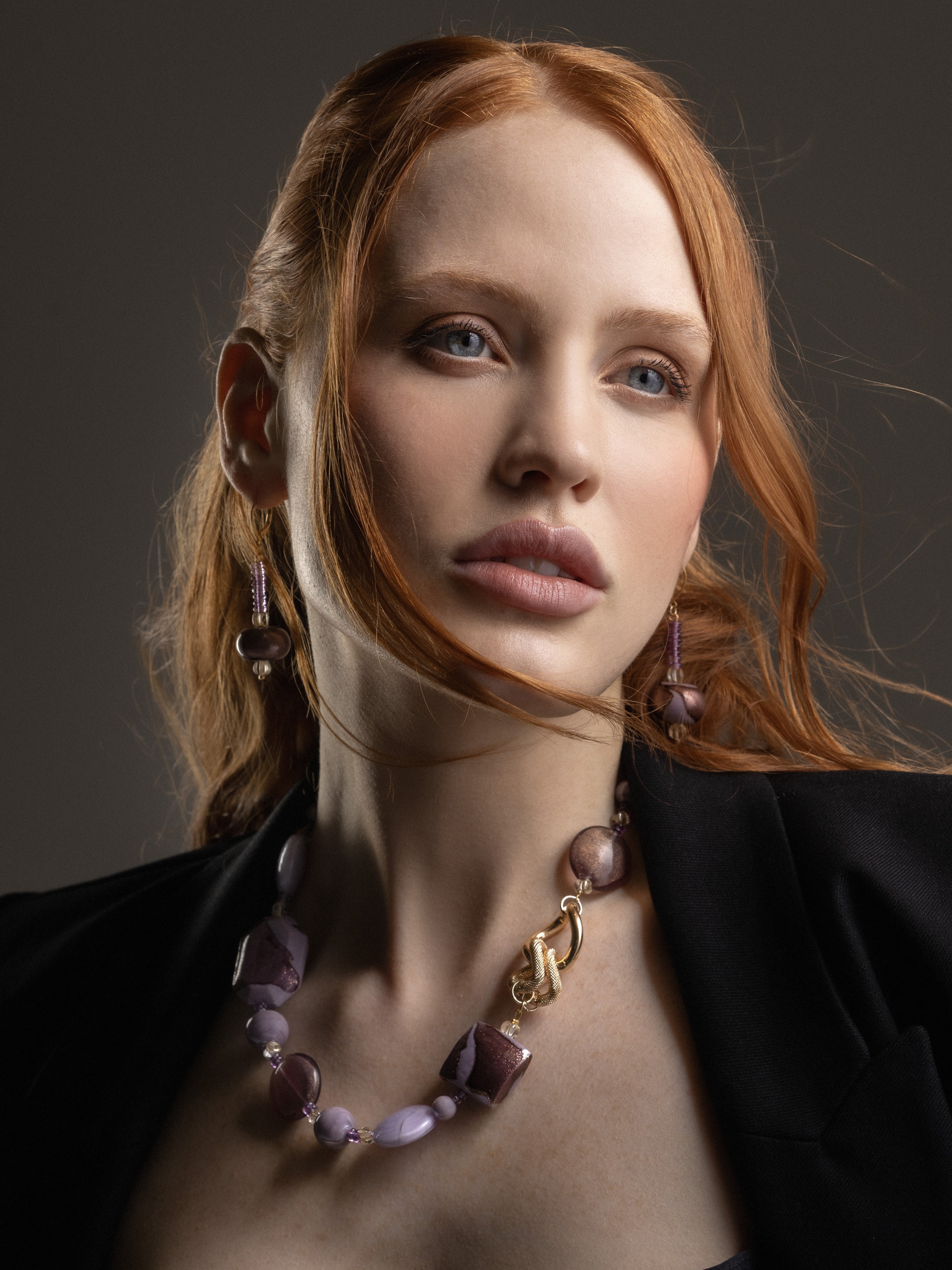 Model wearing MurrinaMurano.us Frame Murano glass drop earrings in pink, with slender beaded drops and rounded sculptural glass accents framing the face. Handcrafted in Italy.