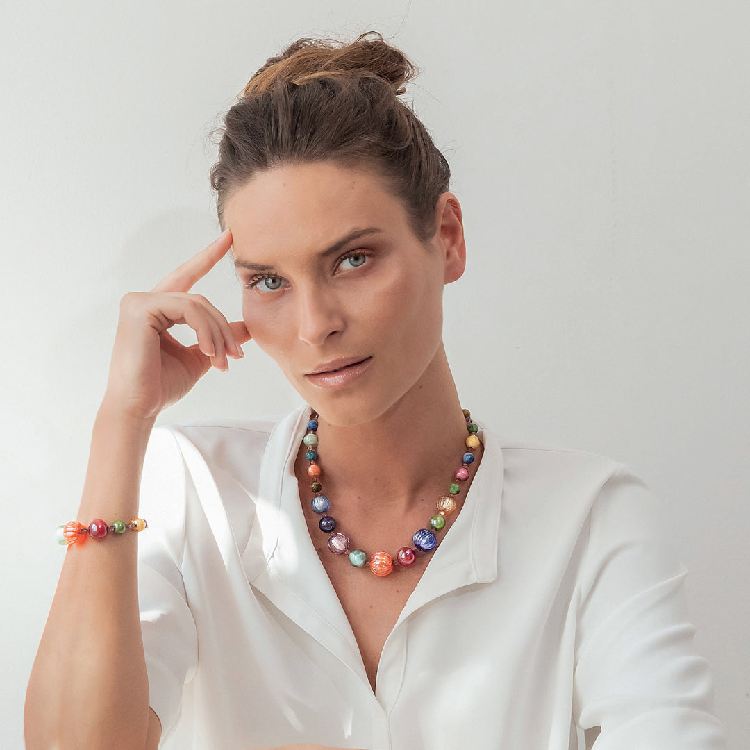 Model wearing a necklace from the Gea collection