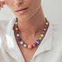 Model wearing MURRINAMURANO Venezia necklace  from the Gea Collection, handcrafted in authentic Murano glass, with 18KT Gold Finish over Stainless Steel, Made in Italy – murrinamurano.us