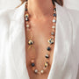 Model wearing MURRINAMURANO Venezia necklace from the Aura Collection, handcrafted in Original Murano glass, 18KT Gold Finish over Brass  and  Stainless Steel Clasp – Made in Italy – murrinamurano.us