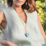 Model wearing MURRINAMURANO Venezia necklace  from the Malika Collection, handcrafted in Original Murano glass with 18KT Gold Finish over Brass and Stainless Steel Clasp, Made in Italy