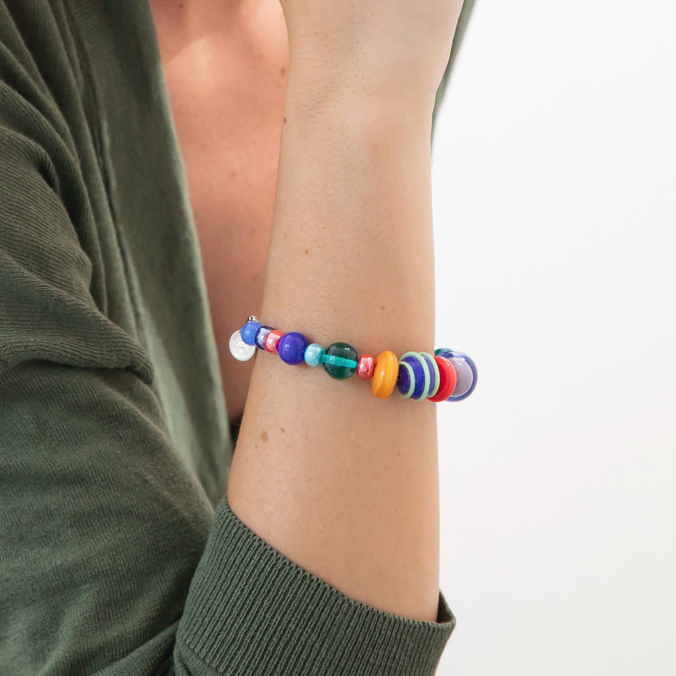 Model wearing MURRINAMURANO Venezia bracelet from the Elettra Collection, handcrafted in Original Murano glass, with Rhodium Finish over Stainless Steel, Made in Italy
