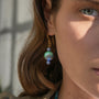 Model wearing MURRINAMURANO Venezia earrings  from the Malika Collection, handcrafted in Original Murano glass, with 18KT Gold Finish over Brass and Stainless Steel hooks