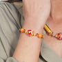 Model wearing MURRINAMURANO Venezia bracelet from the Tasnim Collection, handcrafted in Original Murano glass, Available in 18KT Gold Finish over brass or Rhodium finish over Brass. Made in Italy – murrinamurano.us