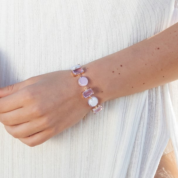 MModel wearing MURRINAMURANO Venezia bracelet from the Sunset Mirage Collection, handcrafted in Original Murano glass,  with 18KT Gold Finish over Brass and Stainless Steel clasp, Made in Italy – Sunset Mirage Collection