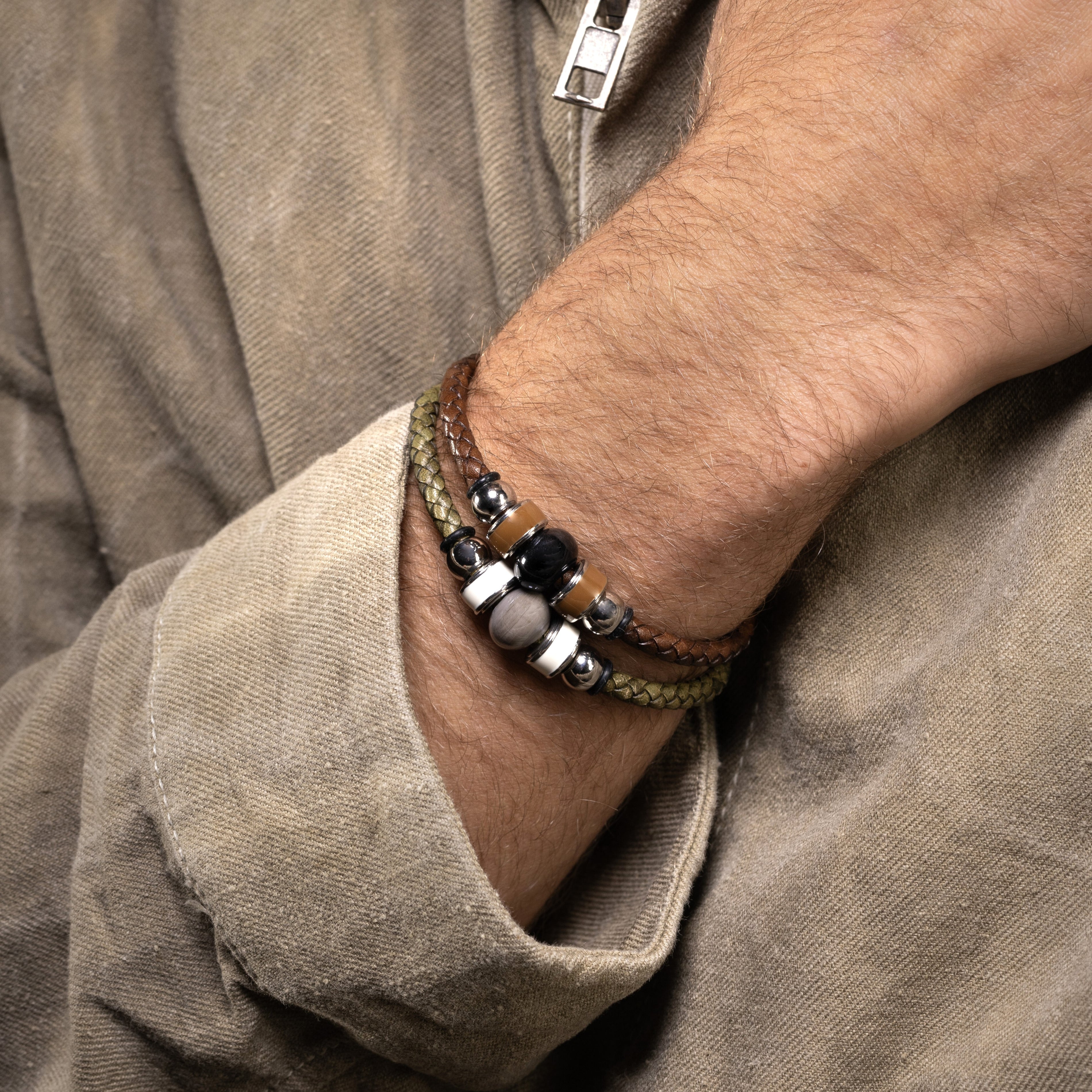 Close-up of a wrist wearing Flare Collection men’s bracelet with braided leather, stainless steel and silicone details, 20 cm length.