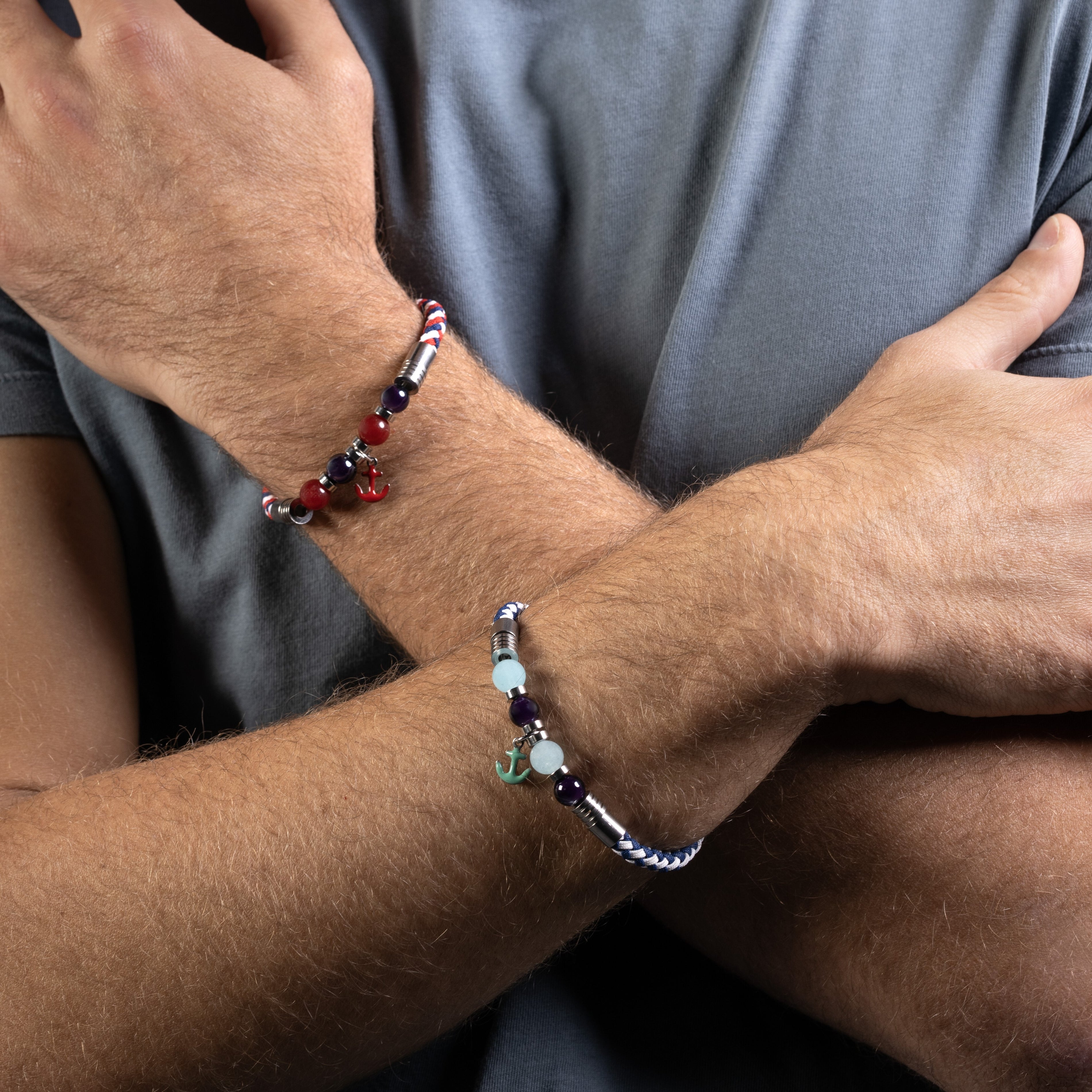 Strike Collection - Murano Glass - Two arms with beaded bracelets on a neutral background