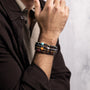 Koko Collection - Person wearing a colorful beaded bracelet on a neutral background