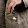 Chunk Collection Murano glass men's keychain, stainless steel and brass with rhodium finish, 9 cm length, handcrafted in Venice, Italy. attached to a pocket.