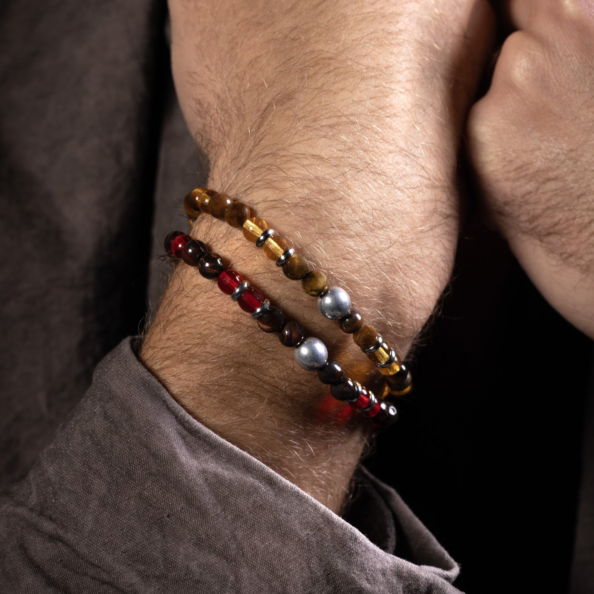 Husk Collection men's bracelet with tiger eye, jasper, labradorite and stainless steel, rhodium finish, adjustable length — angled view.