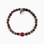 Koko Collection - Bracelet with brown beads and a red accent bead on a white background