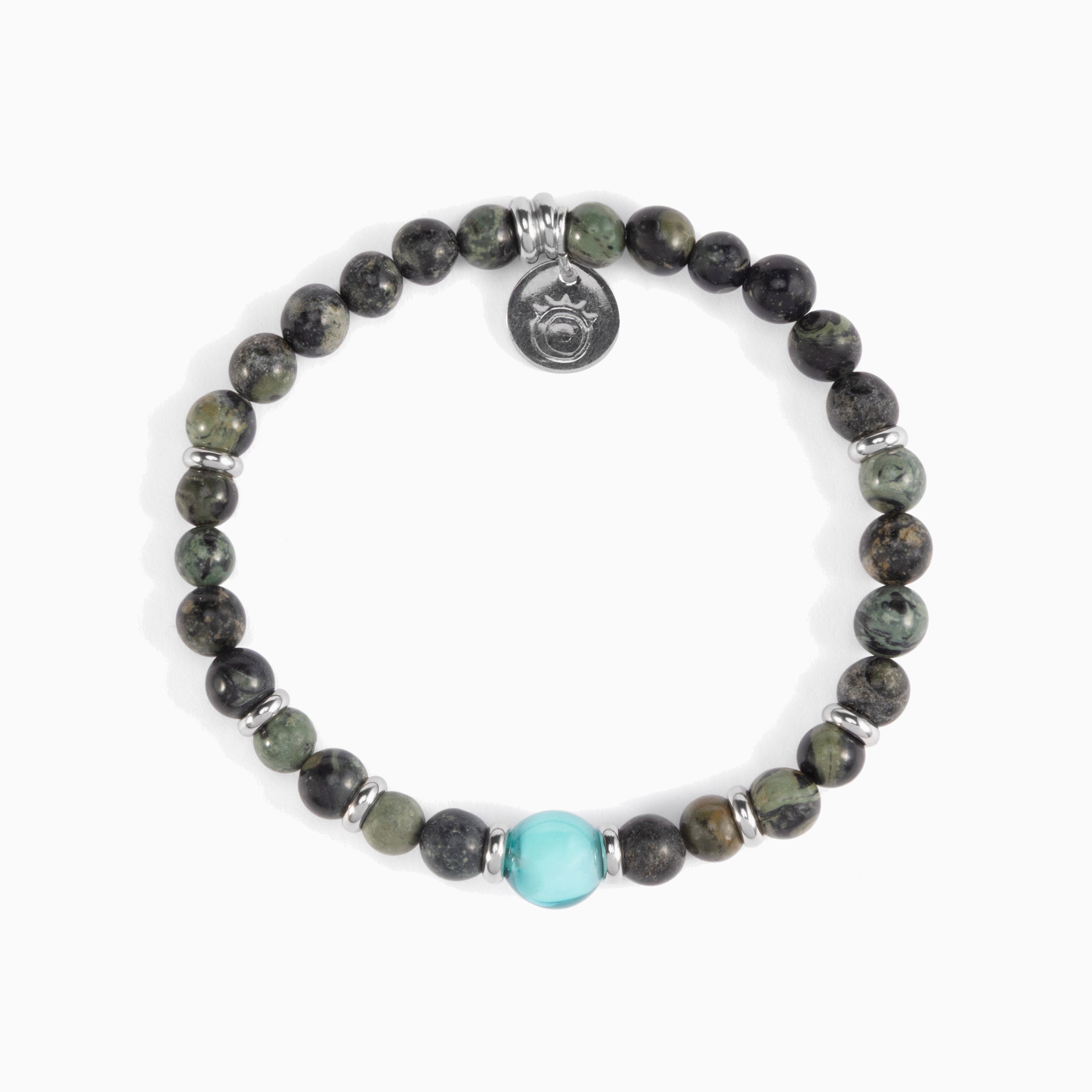 Koko Collection - Beaded bracelet with a turquoise bead and silver charm on a white background