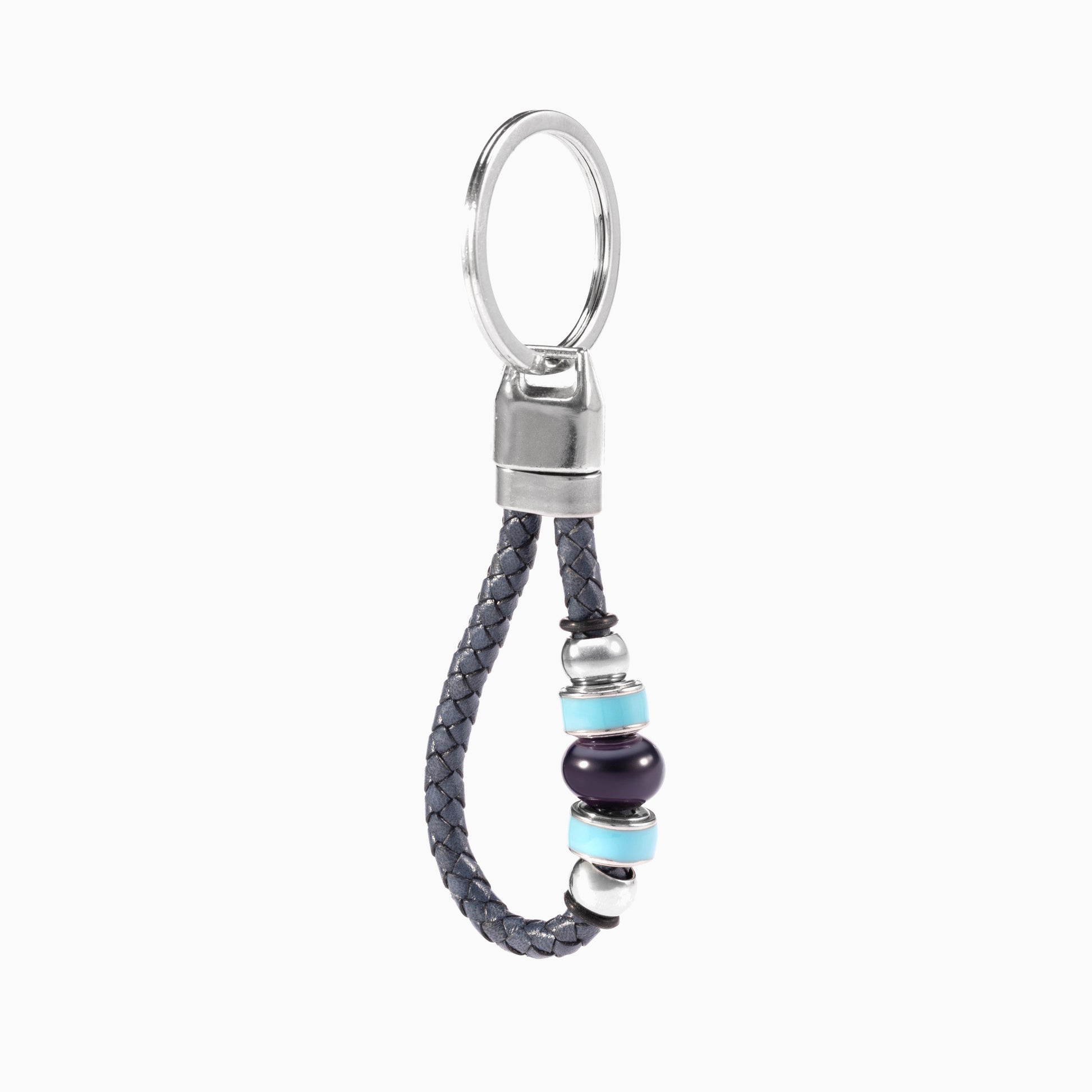 Flare Collection men's keychain with Murano glass, braided leather, rhodium finish over stainless steel, brass and silicone details, 10 cm length — angled view.