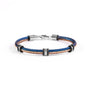 Split men's bracelet — stainless steel cable with blue and brown braided cord, contemporary industrial design, on a white background.