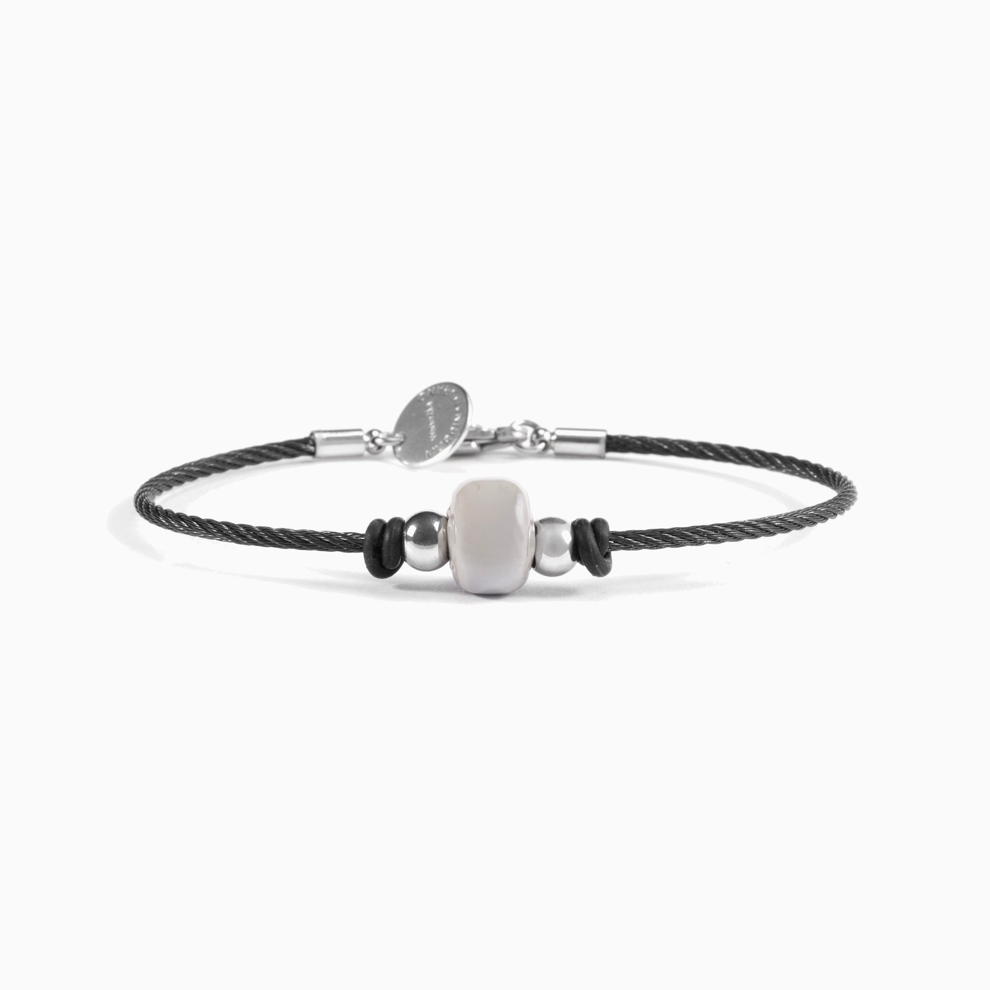 Detail of the Ghost men's bracelet showing the woven stainless steel cable and silicone detailing.