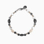 Hush Collection men's bracelet with lava stone, stainless steel and brass, rhodium finish, 20 cm length — angled view.