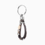 Hush Collection men’s keychain with leather, lava stone, stainless steel and brass, rhodium finish, 10 cm length.