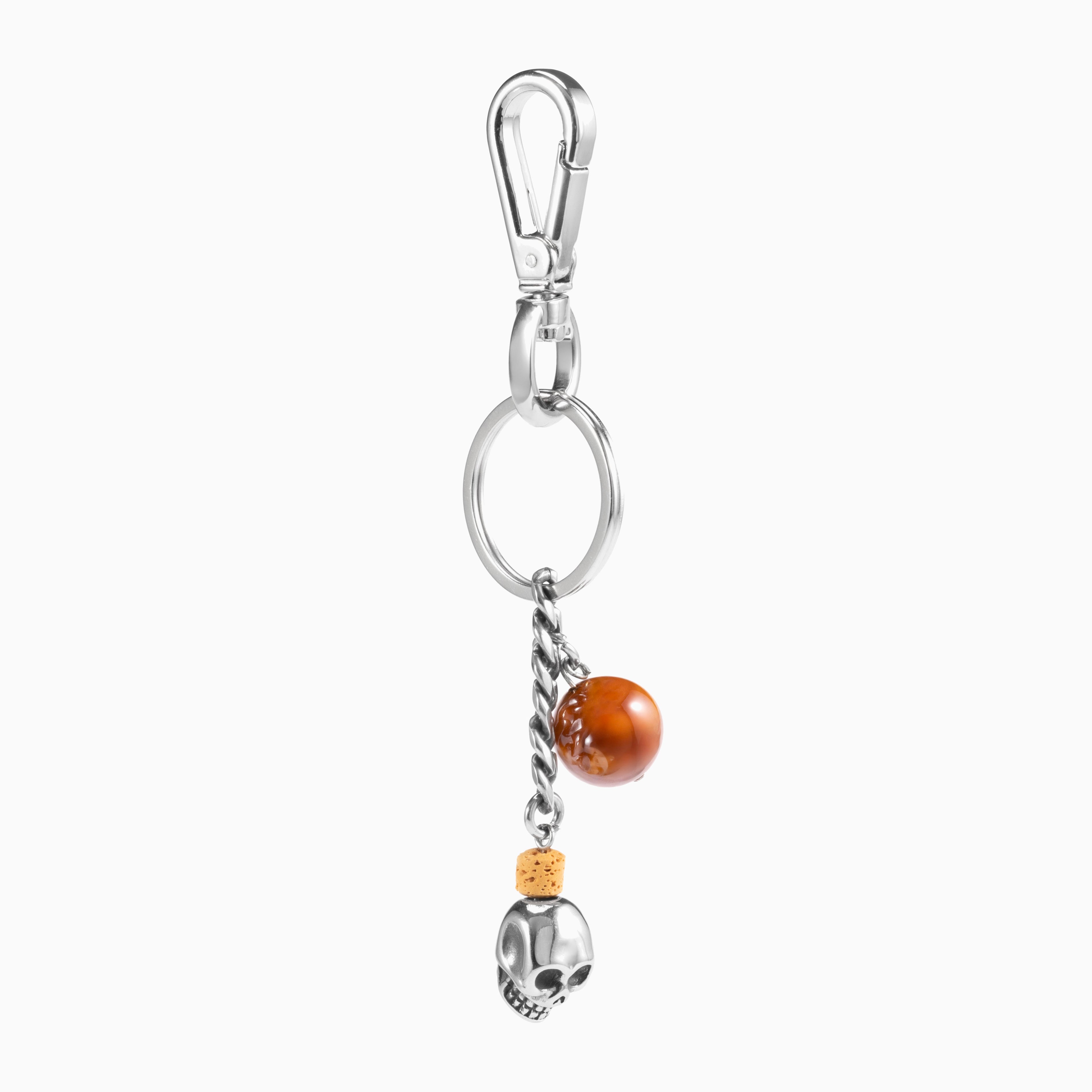 Dusk Collection men’s keychain with lava stone bead, stainless steel hardware and brass accent, 13 cm length, skull detail.