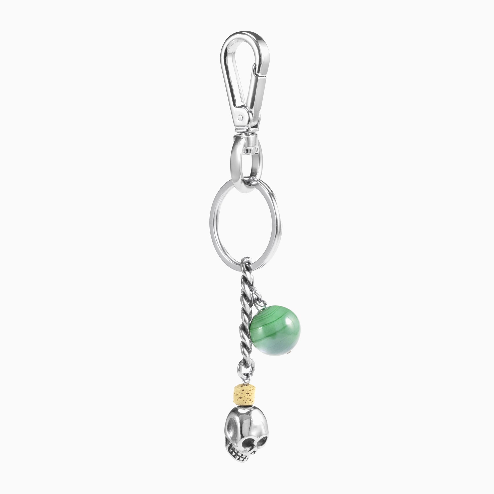 Dusk Collection men's keychain with lava stone bead, stainless steel hardware and brass accent, 13 cm length, skull detail — angled view.