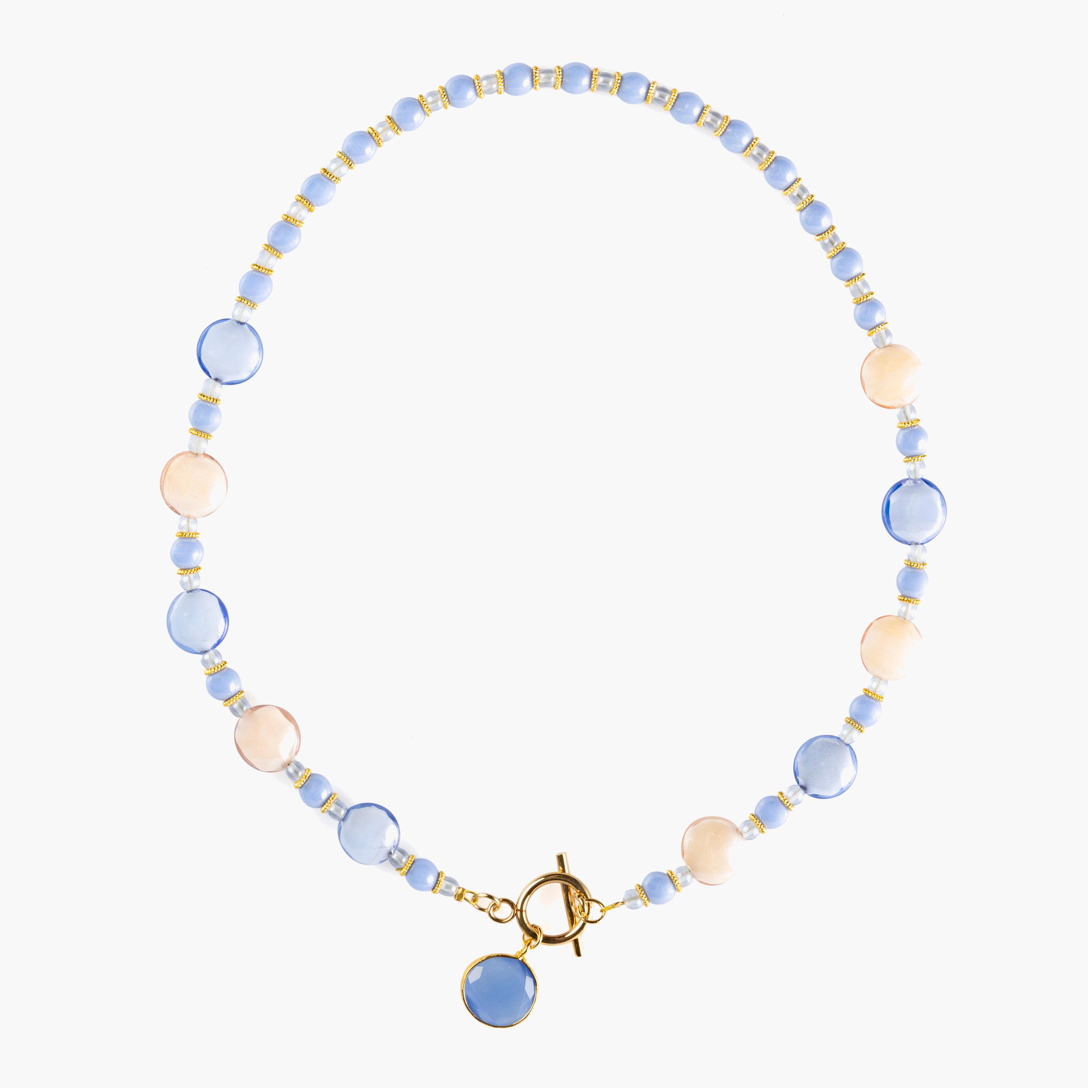 MurrinaMurano.us Trace Choker Necklace in blue Murano Glass with pale stone accents, gold-toned metal detailing, and a central glass pendant. Handcrafted in Italy.
