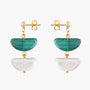 Model wearing Core Drop Earrings in green and white Murano Glass, highlighting the layered glass silhouette and 18KT gold-finished details. Handcrafted in Italy.
