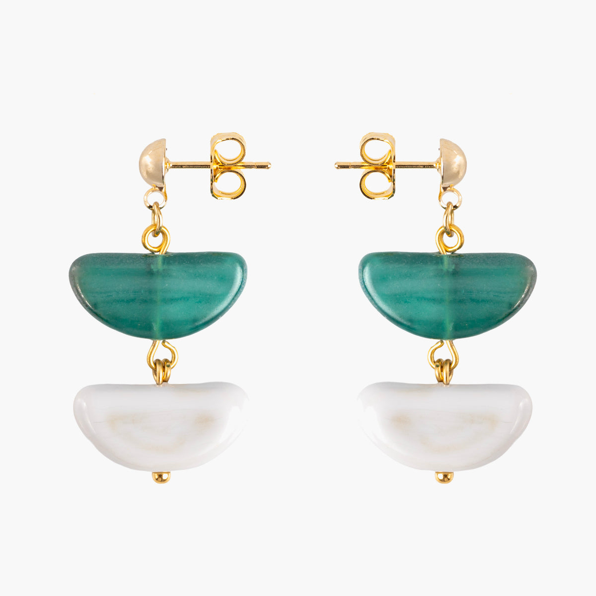 Model wearing Core Drop Earrings in green and white Murano Glass, highlighting the layered glass silhouette and 18KT gold-finished details. Handcrafted in Italy.