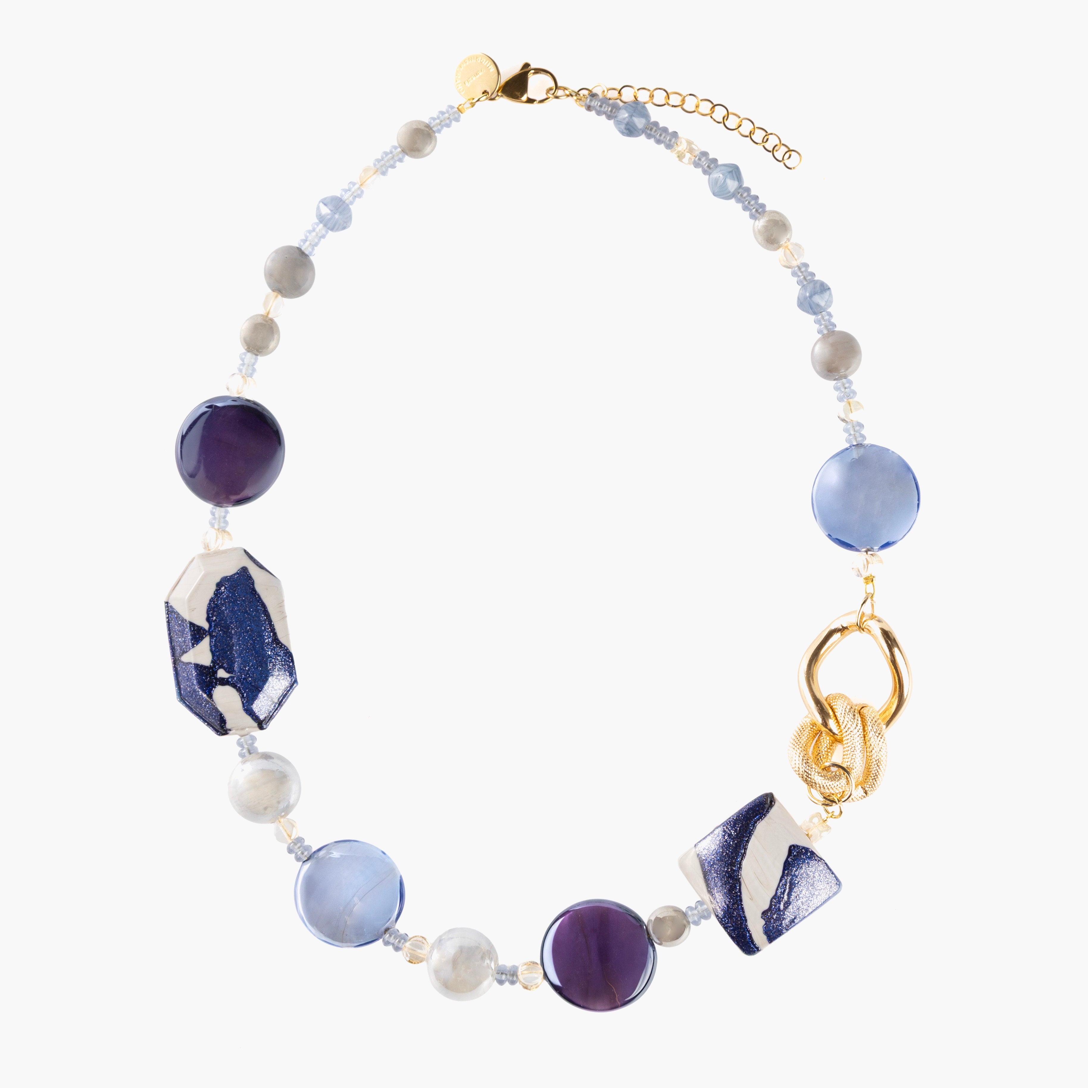 MurrinaMurano.us Frame Choker Necklace in blue and white Murano Glass, featuring sculptural gold-finished metal links and knot details. Handcrafted in Italy.