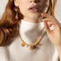 MurrinaMurano.us Veil Choker Necklace with pink and orange Murano Glass accents and 18KT gold-finished details, shown worn at the neckline. Handcrafted in Italy.