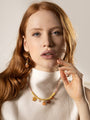 Pink Murano Glass Veil Choker Necklace with orange glass accents and 18KT gold-finished detailing, shown worn. Handcrafted in Italy.