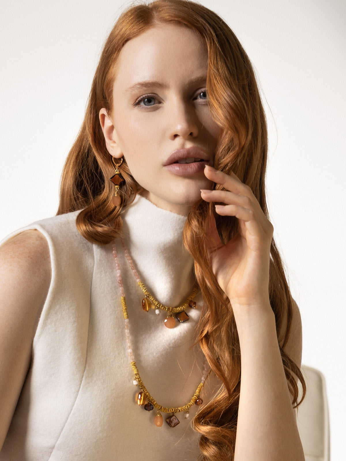 MurrinaMurano.us Murano Glass long necklace with pale pink beads, gold-finish details, and dangling stone accents. Handcrafted in Italy.