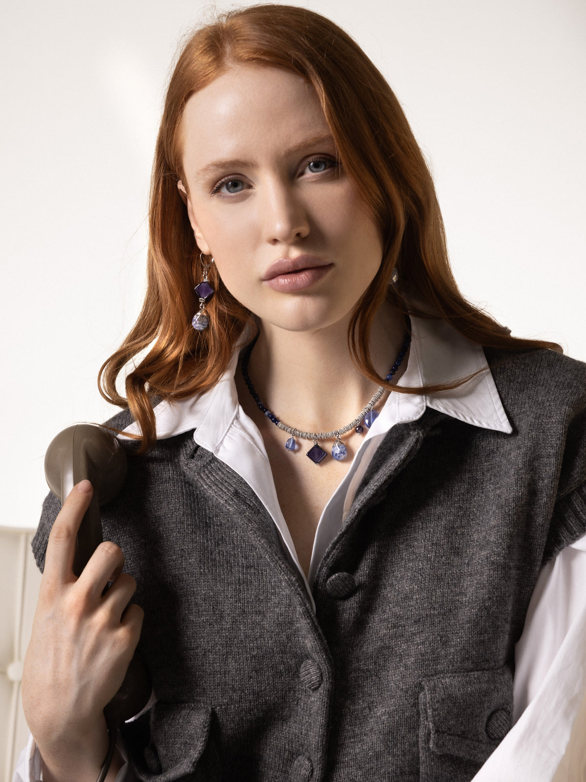 MurrinaMurano.us Veil Choker Necklace in blue and cobalt Murano Glass with 18KT silver-finished details, styled on a model. Handcrafted in Italy.