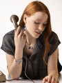 Murrinamurano.Us Blue Veil Bracelet with dark blue Murano Glass beads and silver-toned details, shown worn. Handcrafted in Italy.