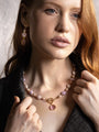 MurrinaMurano.us pink Trace Drop Earrings featuring translucent Murano Glass beads, fine gold-finished details, and faceted pendant elements, shown worn on a model. Handcrafted in Italy.