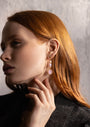 MurrinaMurano.us model wearing pink Trace Drop Earrings alongside a matching Murano Glass necklace, highlighting the coordinated color palette and gold-finished details. Handcrafted in Italy.