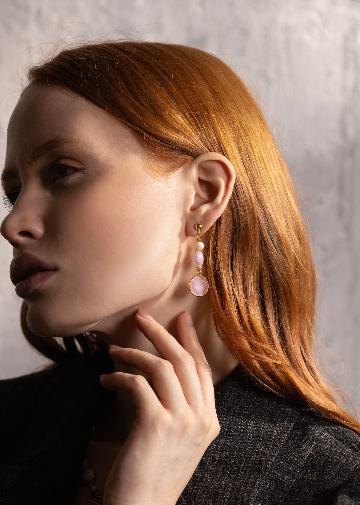 MurrinaMurano.us model wearing pink Trace Drop Earrings alongside a matching Murano Glass necklace, highlighting the coordinated color palette and gold-finished details. Handcrafted in Italy.