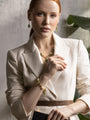 MurrinaMurano.us green Trace Bracelet styled on the wrist, combining rounded Murano Glass beads, natural stone accents, gold-finished spacer details, and a faceted glass pendant. Handcrafted in Italy.