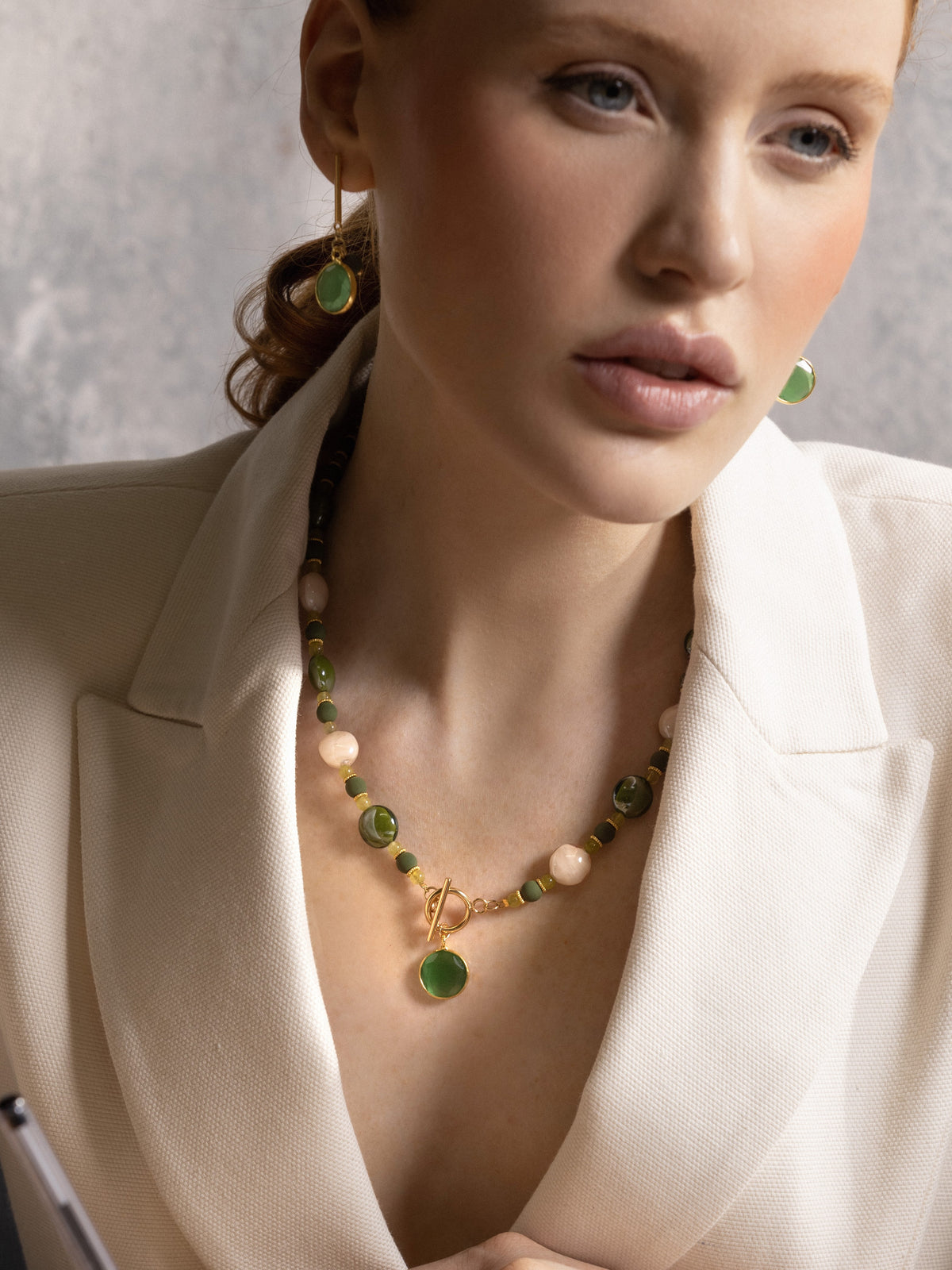 Green Trace Choker Necklace with translucent Murano Glass beads, light stone accents, gold spacer rings, and a decorative toggle clasp. Made in Italy.