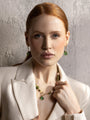 MurrinaMurano.us green Trace Choker Necklace styled at the neckline, featuring alternating Murano Glass beads, delicate gold spacer details, and a central green pendant. Handcrafted in Italy.