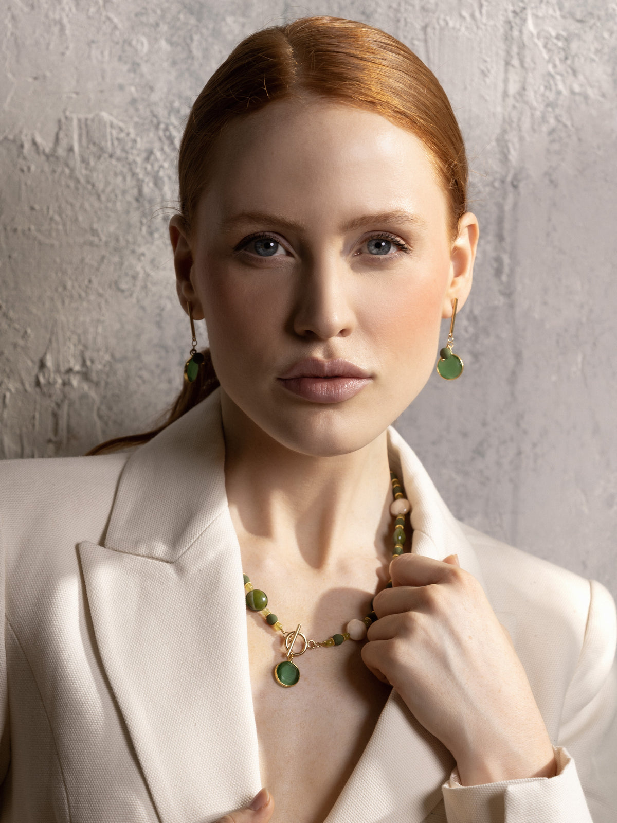 MurrinaMurano.us green Trace Choker Necklace styled at the neckline, featuring alternating Murano Glass beads, delicate gold spacer details, and a central green pendant. Handcrafted in Italy.