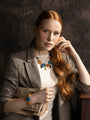 MurrinaMurano.us Edge Choker Necklace with blue and orange Murano glass elements, faceted crystal drops, and gold finish details.