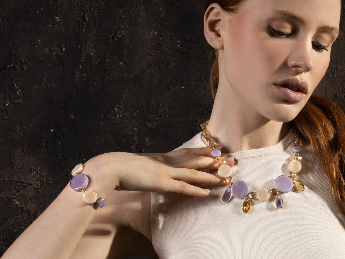 MurrinaMurano.us Edge Bracelet with lilac-colored Murano glass elements, worn with matching Italian artisan jewelry.