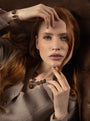 MurrinaMurano.us model wearing a Core Choker Necklace in brown and gray Murano Glass with a faceted natural stone pendant and 18KT gold-finished details. Handcrafted in Italy.
