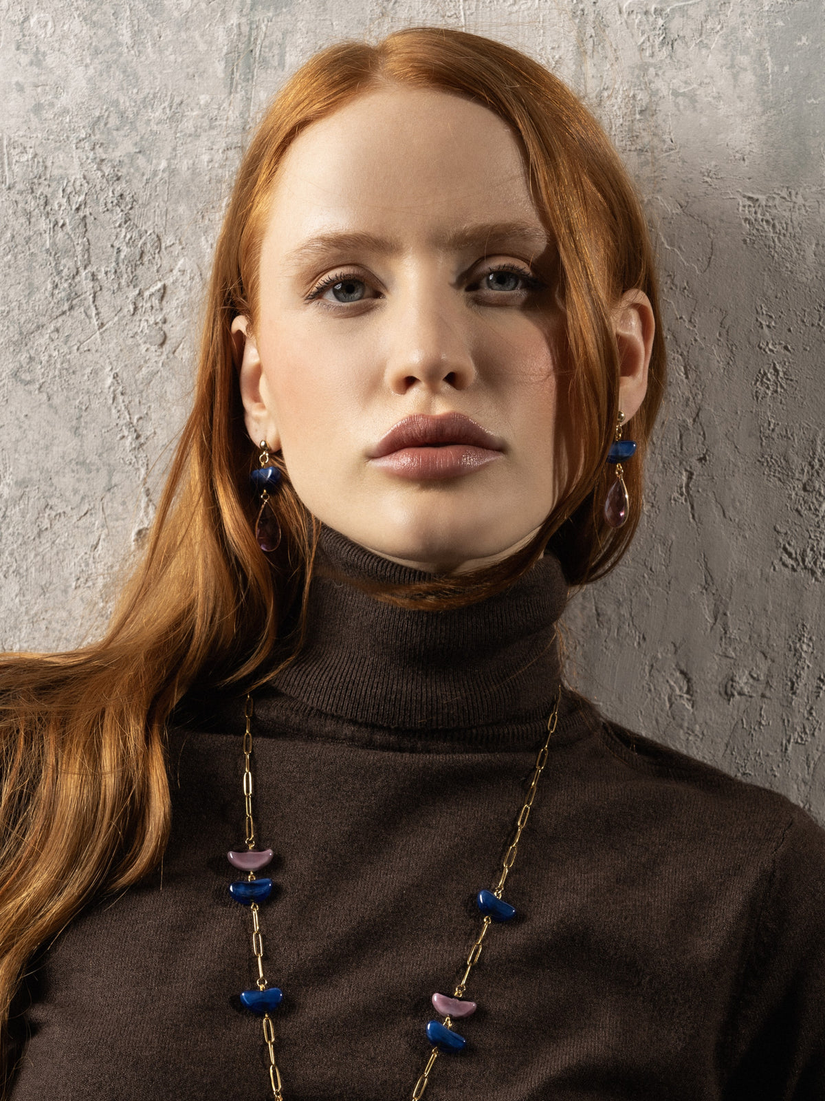 MurrinaMurano.us model wearing amber-brown Core Top Drop Earrings with lilac faceted crystal drops and polished gold-finished details. Handcrafted in Italy.