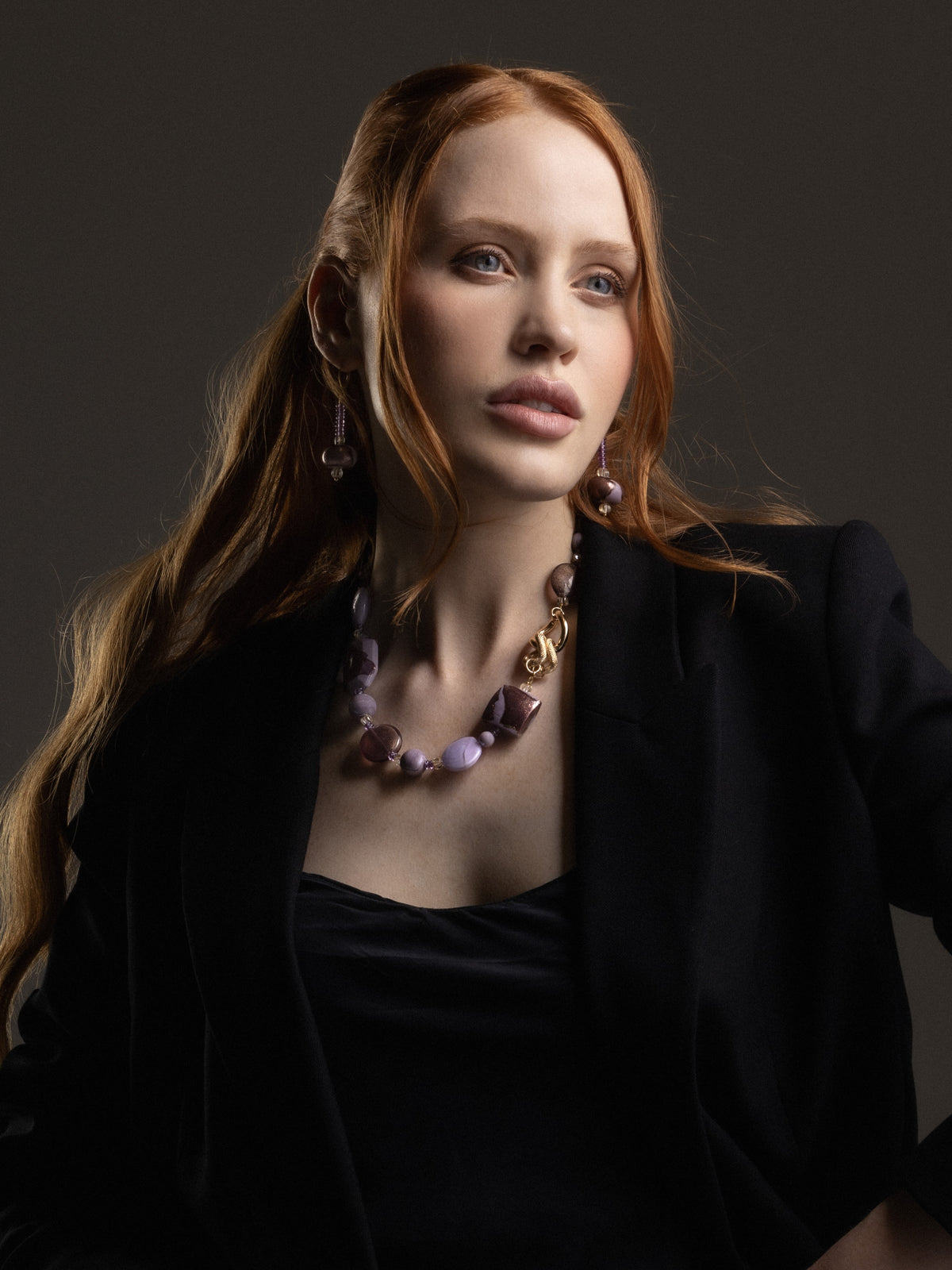 “MurrinaMurano.us model wearing Frame drop earrings in soft pink Murano Glass, with delicate lilac-toned glass beads and rounded rose-colored accents creating an elegant elongated silhouette. Handcrafted in Italy.