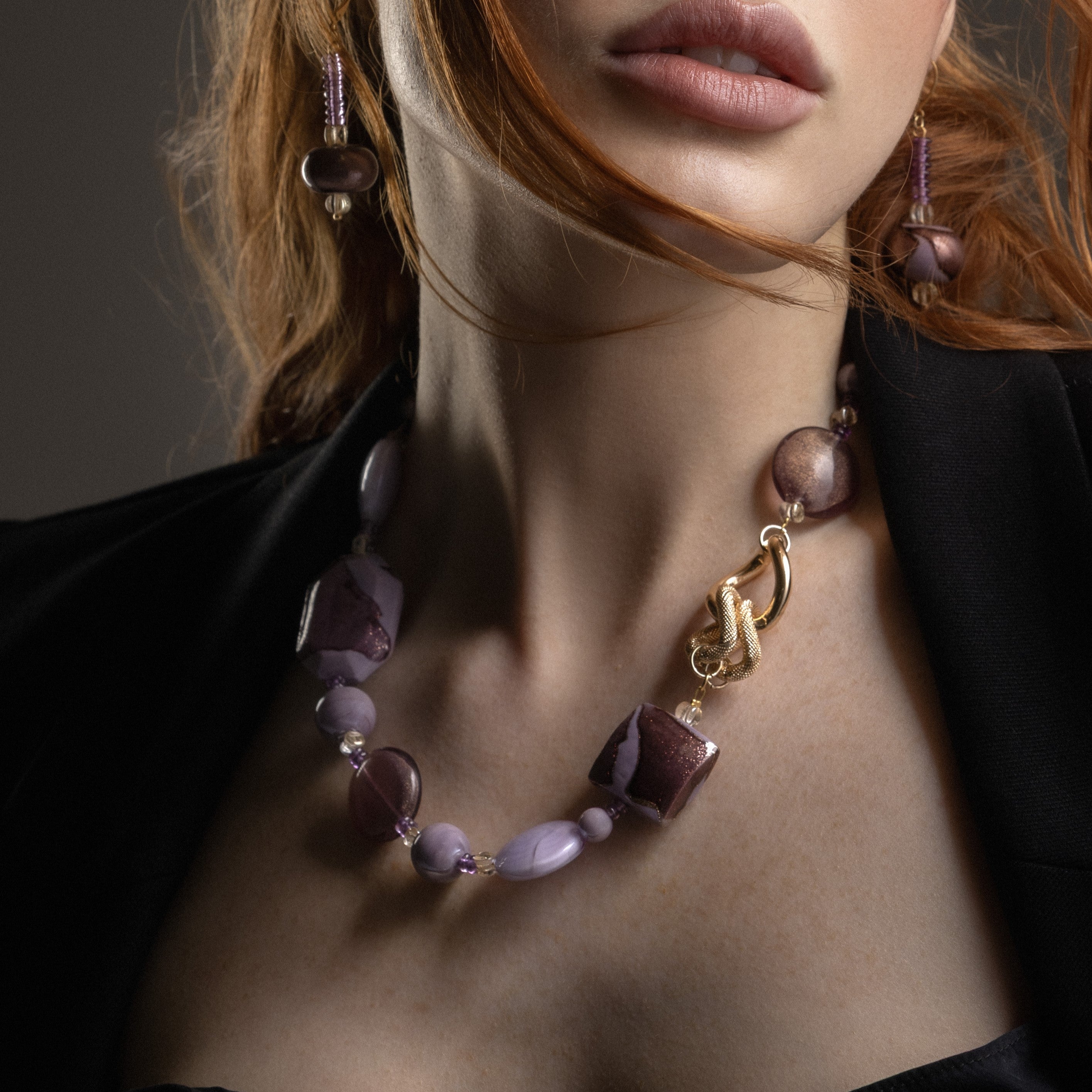 MurrinaMurano.us close-up of the pinkFrame Choker Necklace, highlighting translucent pink Murano Glass, faceted white elements, and sculptural interlocking gold-finished metal details. Handcrafted in Italy.