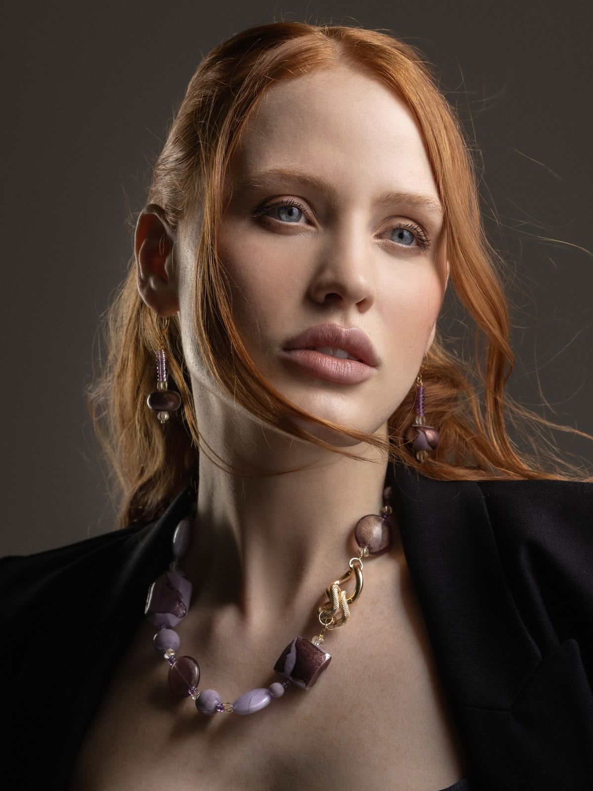 Model wearing MurrinaMurano.us Frame Murano glass drop earrings in pink, with slender beaded drops and rounded sculptural glass accents framing the face. Handcrafted in Italy.