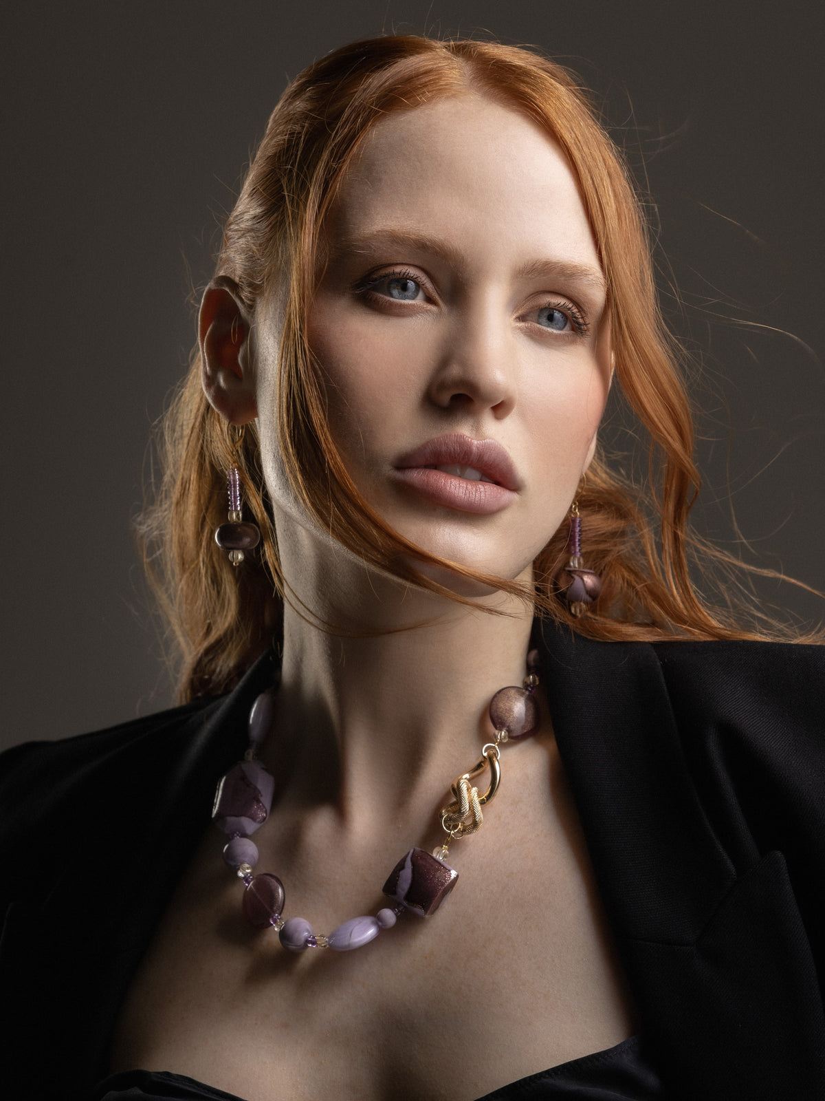 MurrinaMurano.us model wearing the pink Frame Choker Necklace with luminous pink and lilac Murano Glass beads and sculptural gold-finished link details. Handcrafted in Italy.