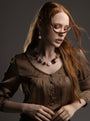MurrinaMurano.us brown Frame Choker Necklace styled at the neckline, combining warm-toned Murano Glass with sculptural 18KT gold-finished metal accents. Handcrafted in Italy.