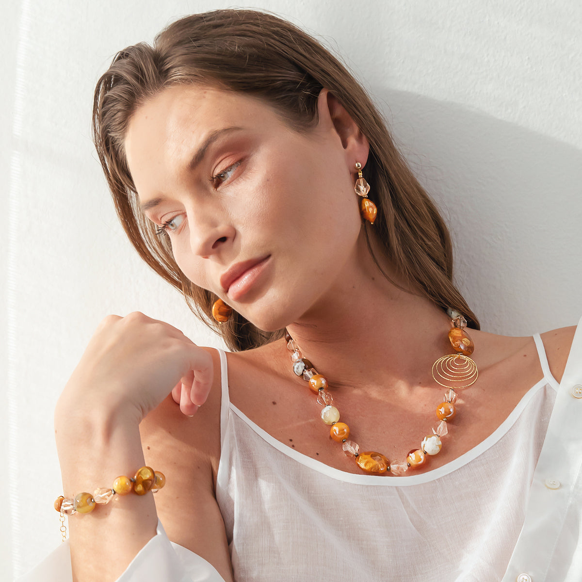 Model wearing colorful Venetian glass necklace from the Aura Collection by MURRINAMURANO venezia